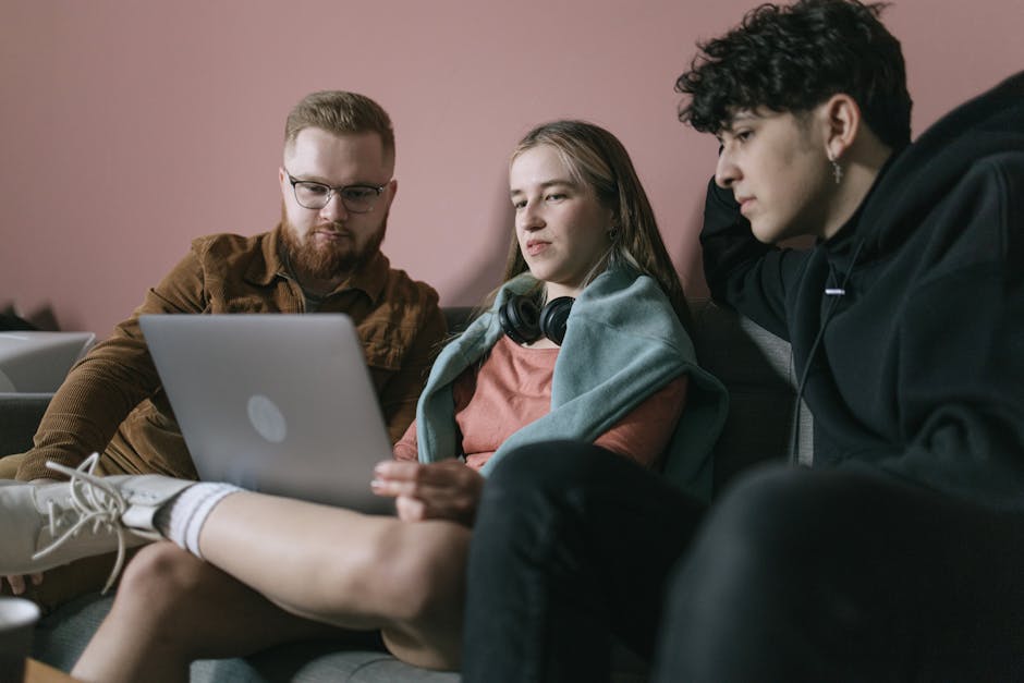 A person carefully reviewing an investment portfolio on their laptop.